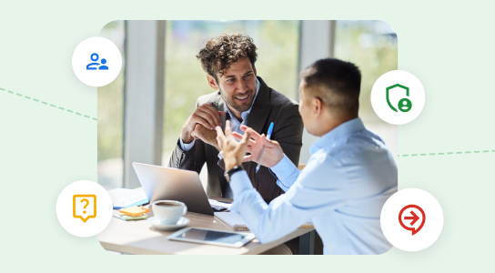 Two people having a meeting over coffee with a laptop and tablet.